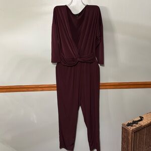 Express maroon jumpsuit. Size: Medium. Twist front. Polyester. Long pant.